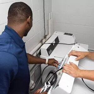 A washing machine being repaired
