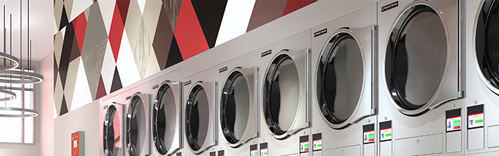 A row of silver laundry equipment